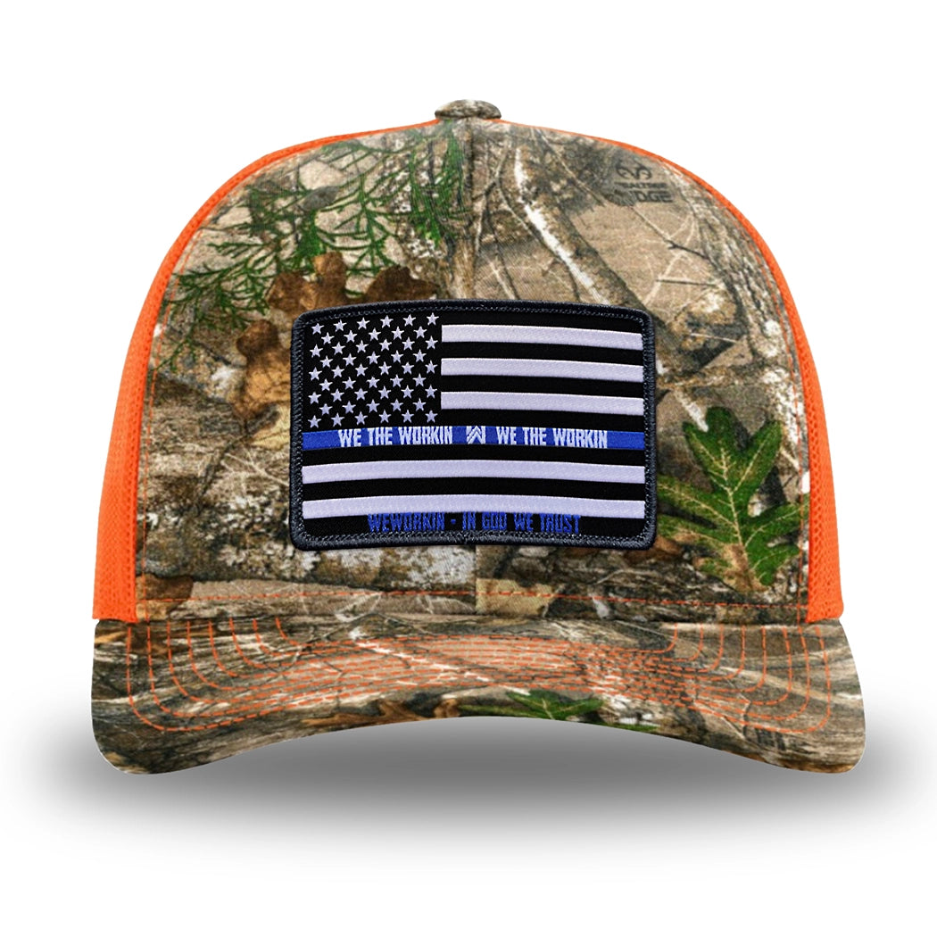 Neon Orange and RealTree Camo two-tone WeWorkin hat—Richardson 112 brand snapback, retro trucker classic hat style. LEO FLAG woven patch with black merrowed edge is centered on the front panels.