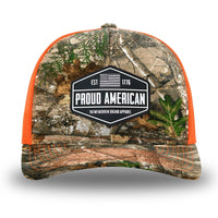 Neon Orange and RealTree Camo two-tone WeWorkin hat—Richardson 112 brand snapback, retro trucker classic hat style. WeWorkin "PROUD AMERICAN" silicone patch is centered on the front panels.