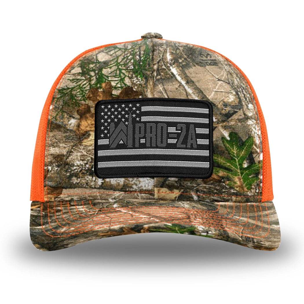 Neon Orange and RealTree Camo two-tone WeWorkin hat—Richardson 112 brand snapback, retro trucker classic hat style. PRO-2A woven patch with black merrowed edge is centered on the front panels.
