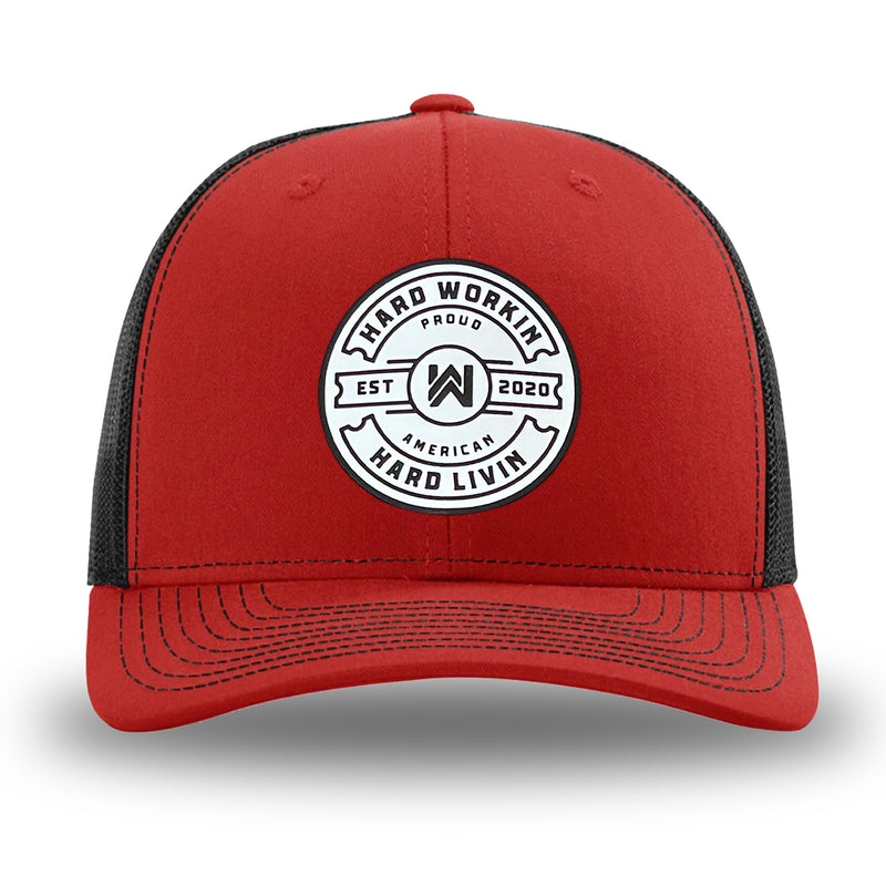 Red and Black WeWorkin hat—Richardson 112 brand snapback, retro trucker classic hat style. "HARD WORKIN. HARD LIVIN." Proud American silicone circle patch is centered on the front panels.