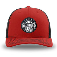 Red/Black WeWorkin hat—Richardson 112 brand snapback, retro trucker classic hat style. WeWorkin "SACRIFICES Must Be Made" circular woven patch, with black/white thread colors and black merrowed edge, is centered on the front panels.