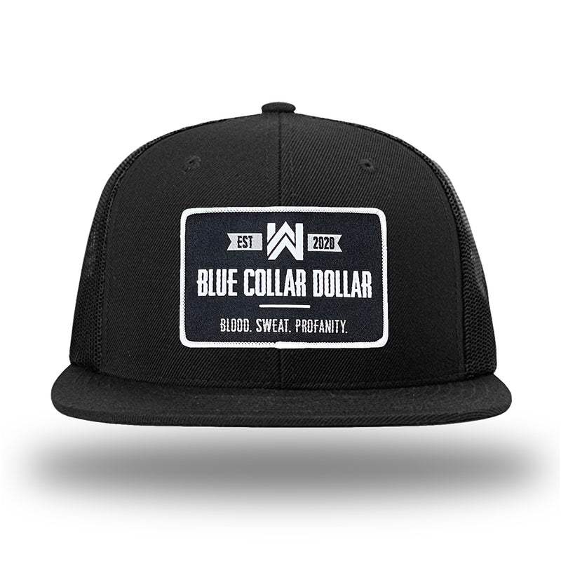 Solid Black WeWorkin hat—Richardson 511 brand snapback, flatbill trucker hat style. WeWorkin "Blue Collar Dollar" rectangle patch is centered large on the front panels. 