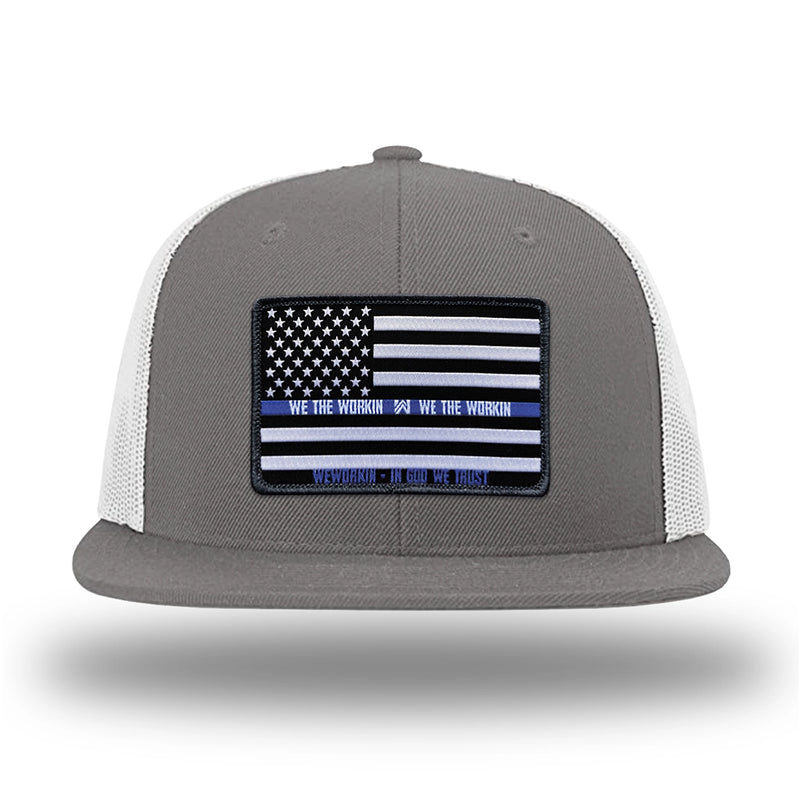 Charcoal/White WeWorkin hat—Richardson 511 brand snapback, flatbill trucker hat style. LEO FLAG woven patch with black merrowed edge is centered on the front panels.