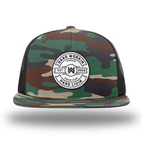 Green Camo/Black WeWorkin hat—Richardson 511 brand snapback, flatbill trucker hat style. "HARD WORKIN. HARD LIVIN." Proud American silicone circle patch is centered on the front panels.