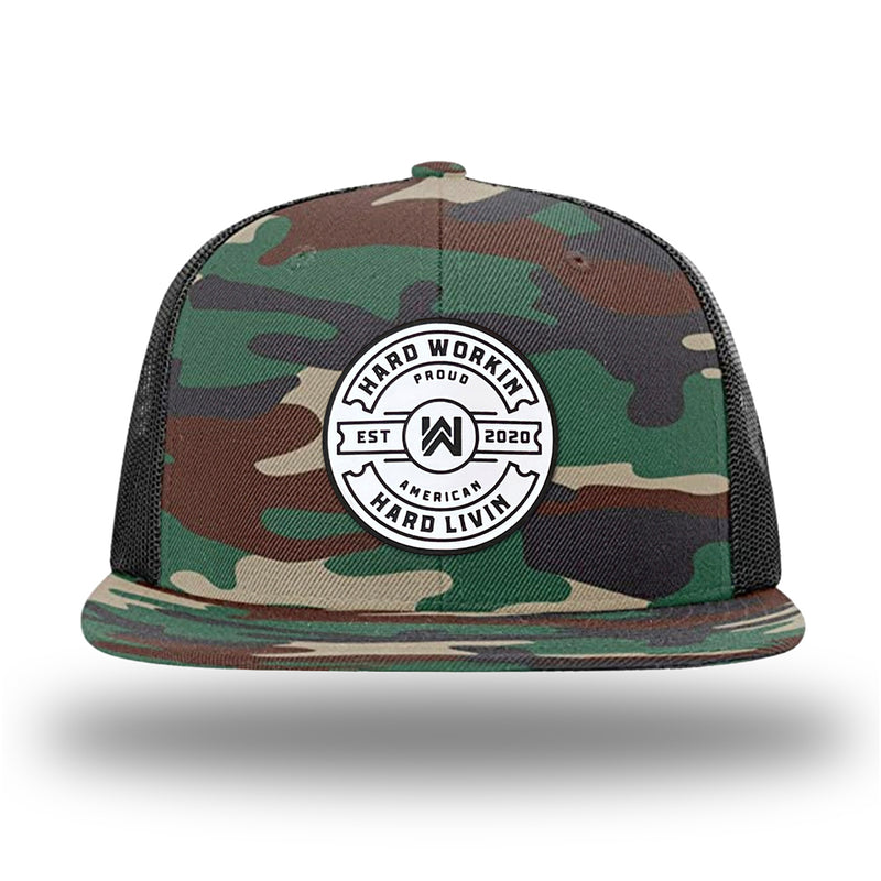 Green Camo/Black WeWorkin hat—Richardson 511 brand snapback, flatbill trucker hat style. "HARD WORKIN. HARD LIVIN." Proud American silicone circle patch is centered on the front panels.