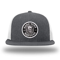 Heather Charcoal/White WeWorkin hat—Richardson 511 brand snapback, flatbill trucker hat style. HARD WORK MATTERS woven patch with white merrowed edge, on a black background with HARD WORK MATTERS text encircling a Viking-style skull center graphic with MM XX on the left and right respectively—patch is centered on the front panels.