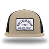 Khaki/Black WeWorkin hat—Richardson 511 brand snapback, flatbill trucker hat style. BLUE COLLAR DOLLAR ARCH (BCD-ARCH) woven patch with black merrowed edge, on a white background with black text, is centered on the front panels.
