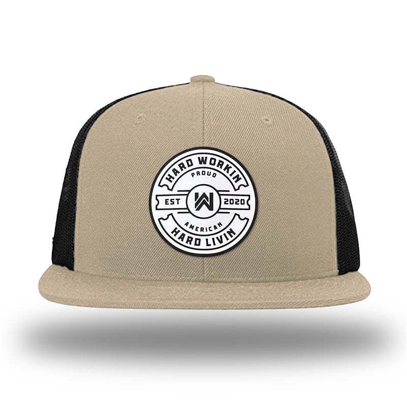 Khaki/Black WeWorkin hat—Richardson 511 brand snapback, flatbill trucker hat style. WeWorkin "HARD WORKIN. HARD LIVIN." Proud American silicone circle patch is centered on the front panels.