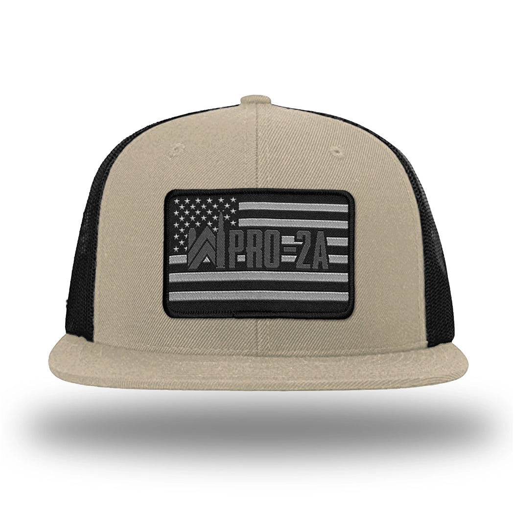 Khaki/Black WeWorkin hat—Richardson 511 brand snapback, flatbill trucker hat style. PRO-2A woven patch with black merrowed edge is centered on the front panels.