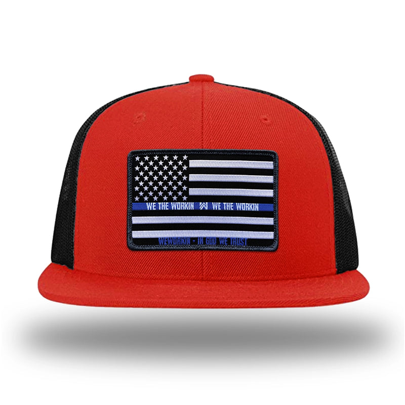 Red/Black WeWorkin hat—Richardson 511 brand snapback, flatbill trucker hat style. LEO FLAG woven patch with black merrowed edge is centered on the front panels.