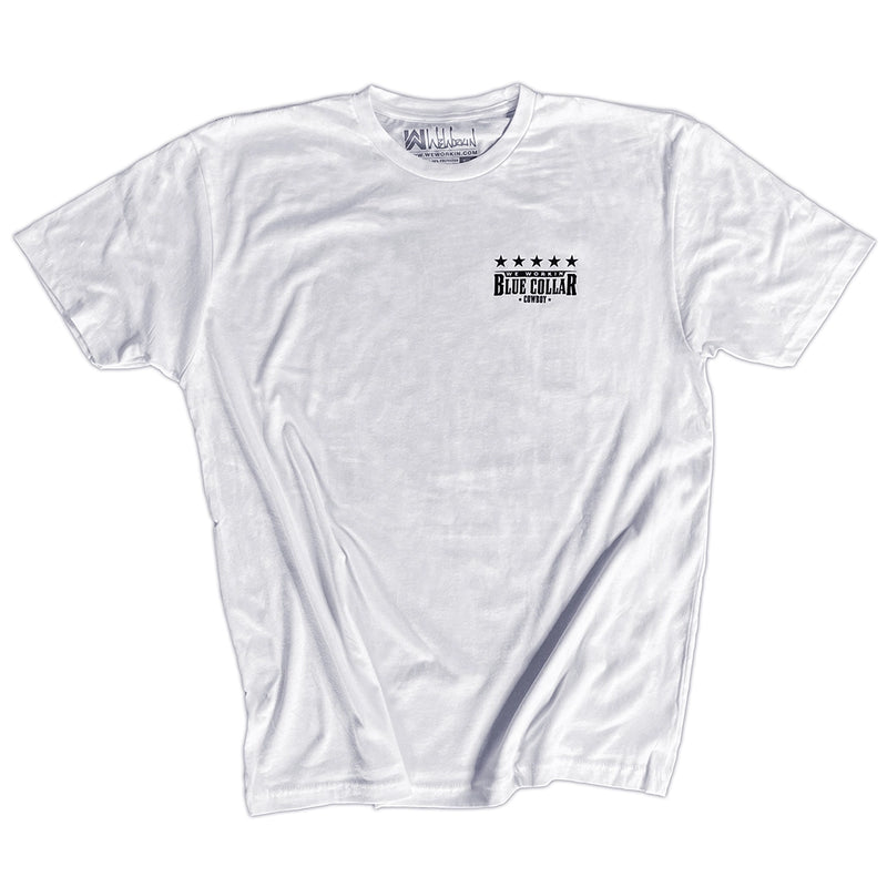 Front pocket area of a WW white tee on a white background. "WE WORKIN. BLUE COLLAR COWBOY" text with stars on the top, printed small on the left chest "pocket" area, in black ink.