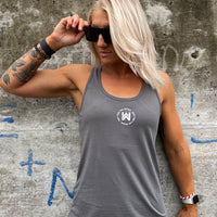 Woman pictured from front wearing a WEWORKIN racerback tank top in grey, with the graphic NOT FOR THE WEAK encircling the WW icon, imprinted small in white ink on the chest.