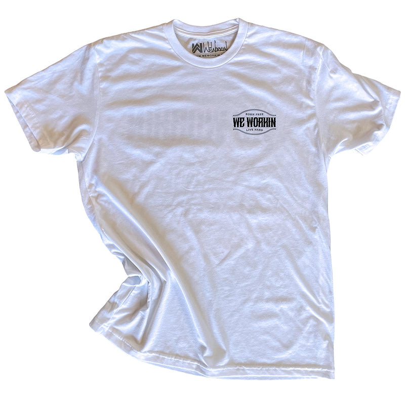 Front pocket area of a WW white tee on a white background. "Born Free WE WORKIN Live Hard" text on 3 lines with curved rope design on the top and bottom of the text, printed small on the left chest "pocket" area, in grey and black ink.