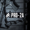 PRO-2A die-cut sticker, put on a gun case where a gun/strap are also on top of case. Our WW icon is re-created with bullets (grey color) as the left and right vertical elements and the rest of the icon and text "PRO-2A" are white on a black background. (Sticker measures approximately 4.5"W x 1.6"H)