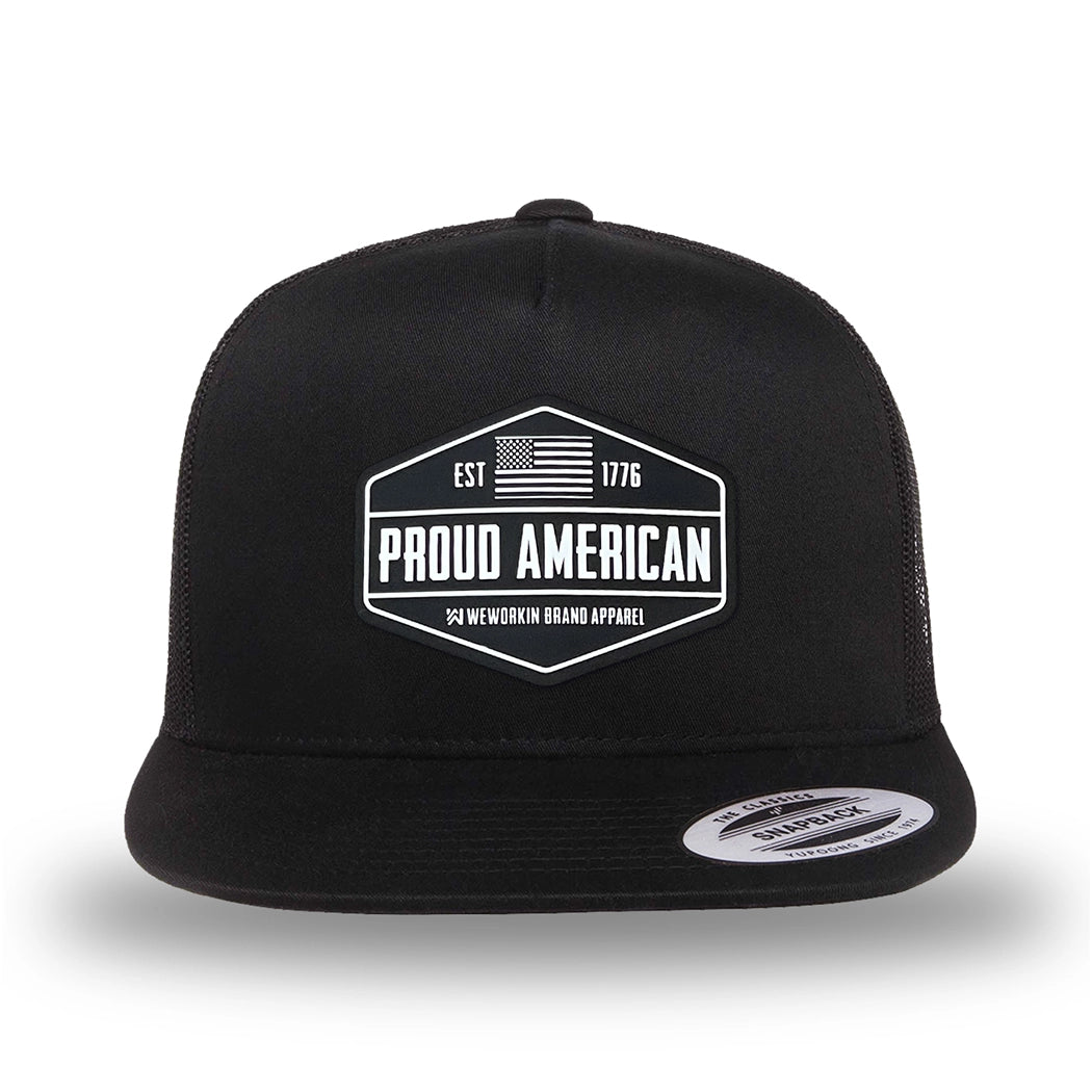 All black, high-profile, WeWorkin hat—snapback, 5-panel classic trucker, mesh sides/back style. WeWorkin "PROUD AMERICAN" silicone patch is centered on the front panel.
