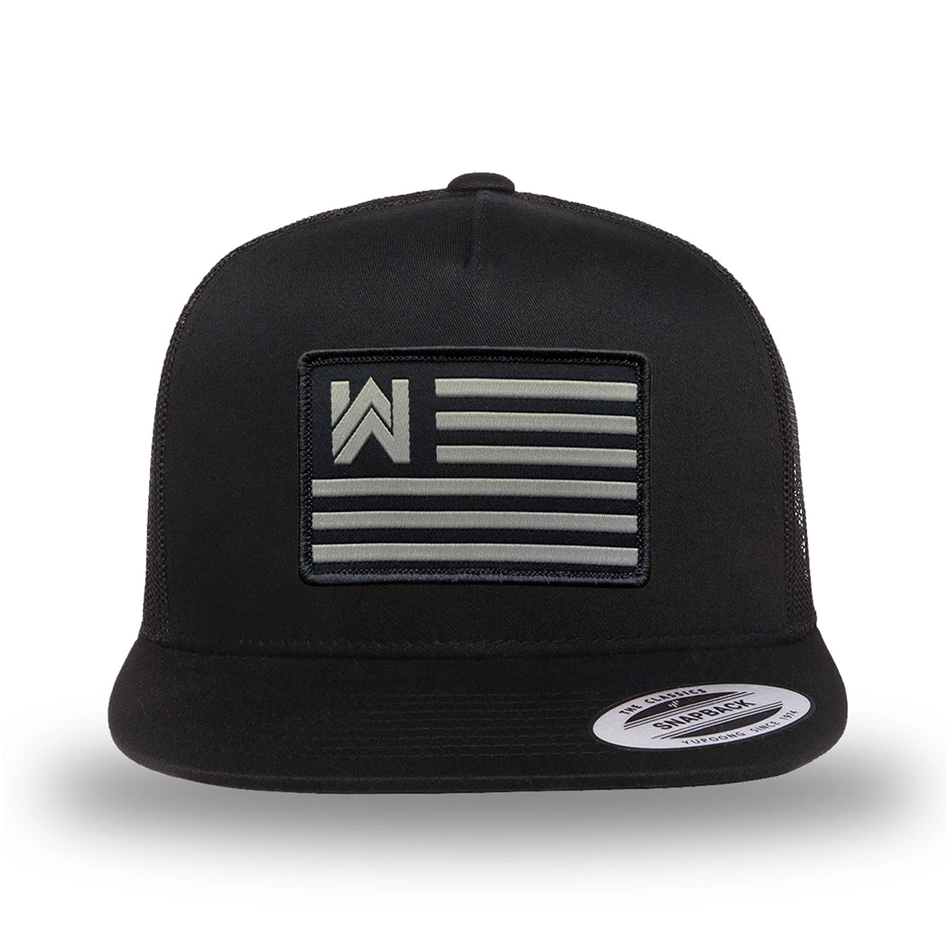 All black, high-profile, WeWorkin hat—snapback, 5-panel classic trucker, mesh sides/back style. We Workin Flag rectangular patch is centered on the front panel.