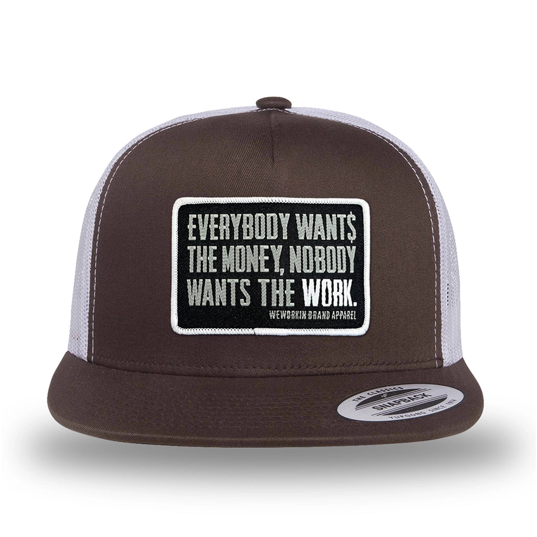 Brown/White two-tone WeWorkin hat—flatbill, snapback, 5-panel classic trucker, mesh-back style. WeWorkin "Everybody Want$ the Money, Nobody Wants the WORK." rectangular woven patch is centered on the front panel.
