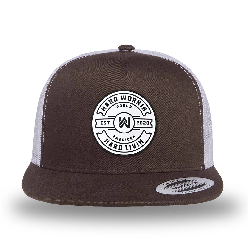 Brown/White two-tone WeWorkin hat—flatbill, snapback, 5-panel classic trucker, mesh-back style. WeWorkin "Hard Workin. Hard Livin. Proud American." circular silicone patch is centered on the front panel.