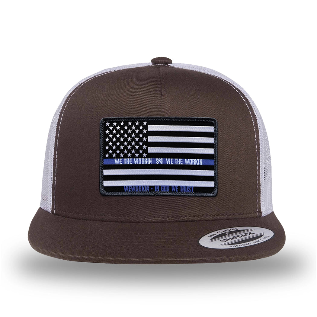 Brown/White two-tone WeWorkin hat—flatbill, snapback, 5-panel classic trucker, mesh-back style. LEO FLAG woven patch with black merrowed edge is centered on the front panel.