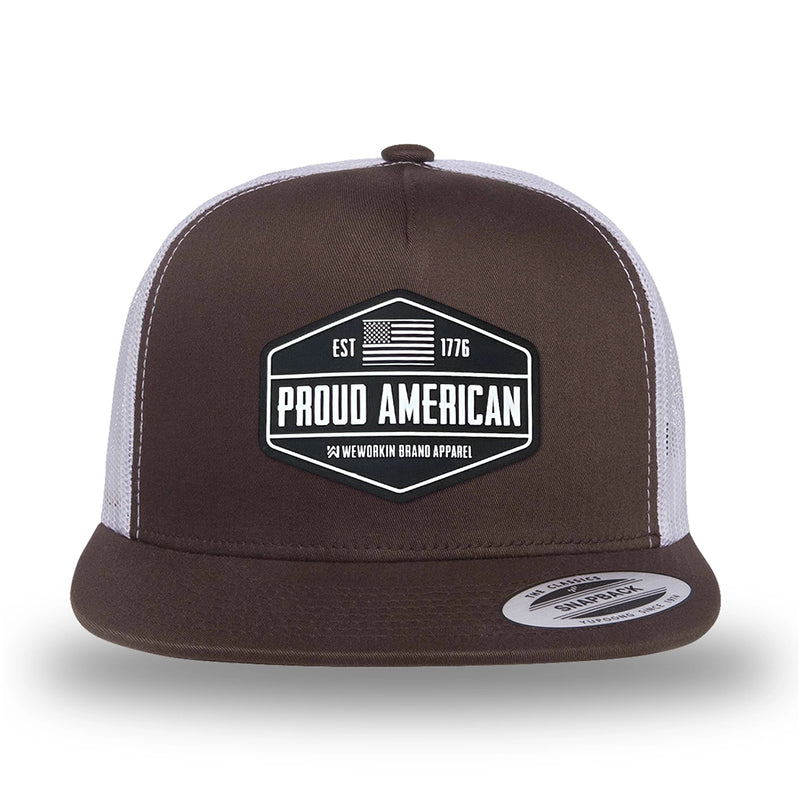 Brown/White two-tone WeWorkin hat—flatbill, snapback, 5-panel classic trucker, mesh-back style. WeWorkin "PROUD AMERICAN" silicone patch is centered on the front panel.