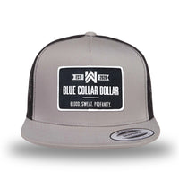 Silver/Black two-tone WeWorkin hat—snapback, 5-panel classic trucker, mesh sides/back style. WeWorkin "Blue Collar Dollar" rectangular woven patch is centered on the front panel.