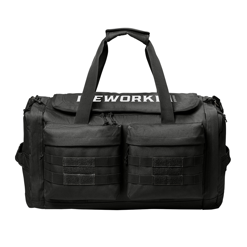 Stealth Black tactical duffle bag pictured from front on a white background. WEWORKIN BRAND logo embroidered in white thread on the top panel. 600D polyester canvas, Covered zipper D-shaped main compartment, [2] zippered end pockets, [2] Front zippered pockets with daisy chain/loop panels for patches (WW patches sold separately), Web carry handles with padded handle wrap, Web grab handles on both ends, Removable/adjustable padded shoulder strap.