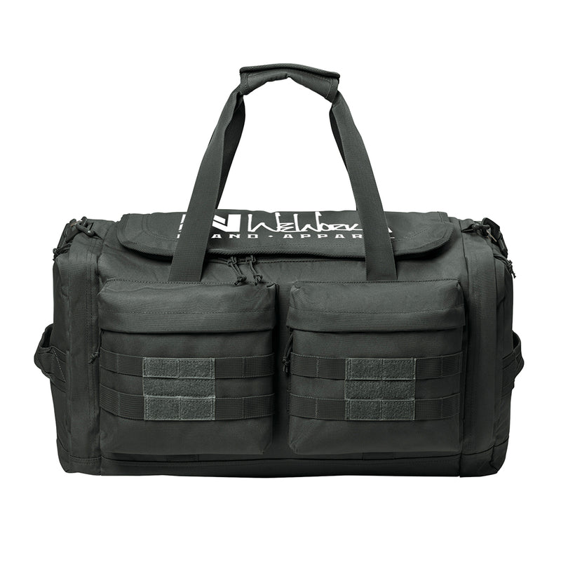 Charcoal Grey tactical duffle bag pictured from front on a white background. WW Script logo embroidered in white thread on the top panel. 600D polyester canvas, Covered zipper D-shaped main compartment, [2] zippered end pockets, [2] Front zippered pockets with daisy chain/loop panels for patches (WW patches sold separately), Web carry handles with padded handle wrap, Web grab handles on both ends, Removable/adjustable padded shoulder strap.