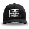 Solid Black WeWorkin hat—Richardson 112 brand snapback, retro trucker classic hat style. WeWorkin "Blue Collar Dollar" patch is centered large on the front panels.