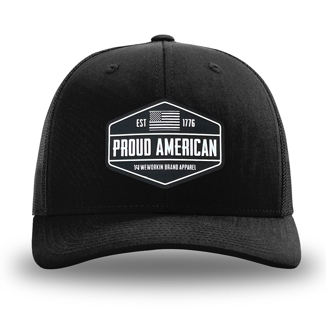 Solid Black WeWorkin hat—Richardson 112 brand snapback, retro trucker classic hat style. WeWorkin black and white "PROUD AMERICAN" silicone patch is centered on the front panels.
