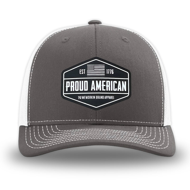 Charcoal/White WeWorkin hat—Richardson 112 brand snapback, retro trucker classic hat style. WeWorkin black and white "PROUD AMERICAN" silicone patch is centered on the front panels.