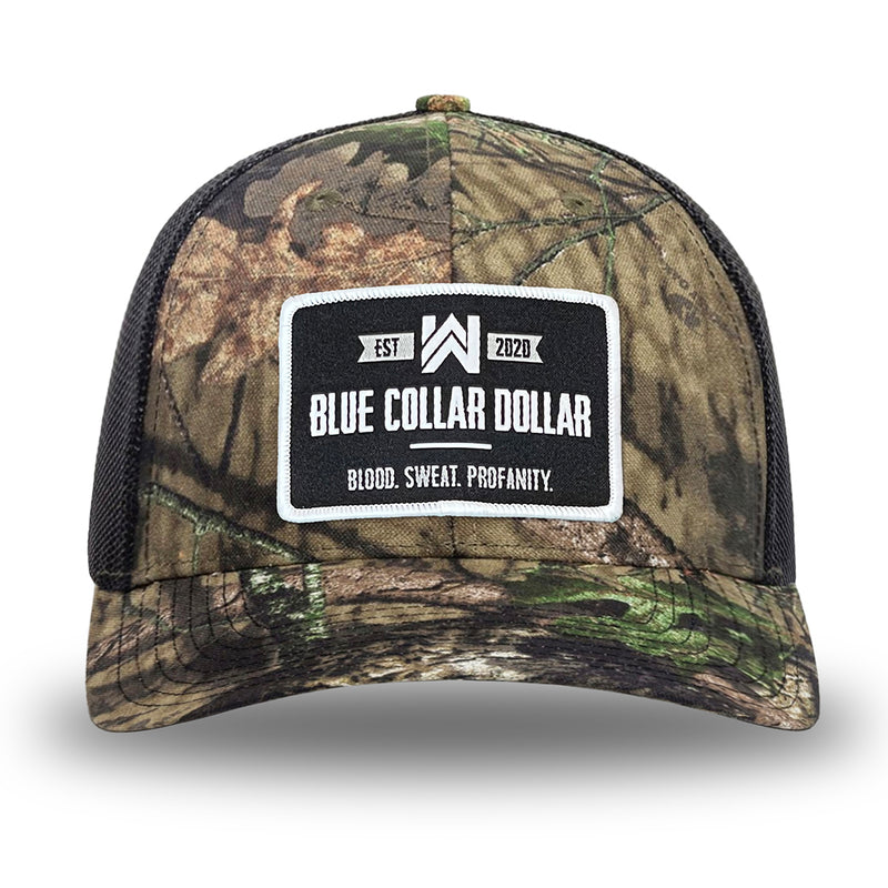 Mossy Oak/Country DNA/Black WeWorkin hat—Richardson 112 brand snapback, retro trucker classic hat style. WeWorkin "Blue Collar Dollar" patch is centered large on the front panels.