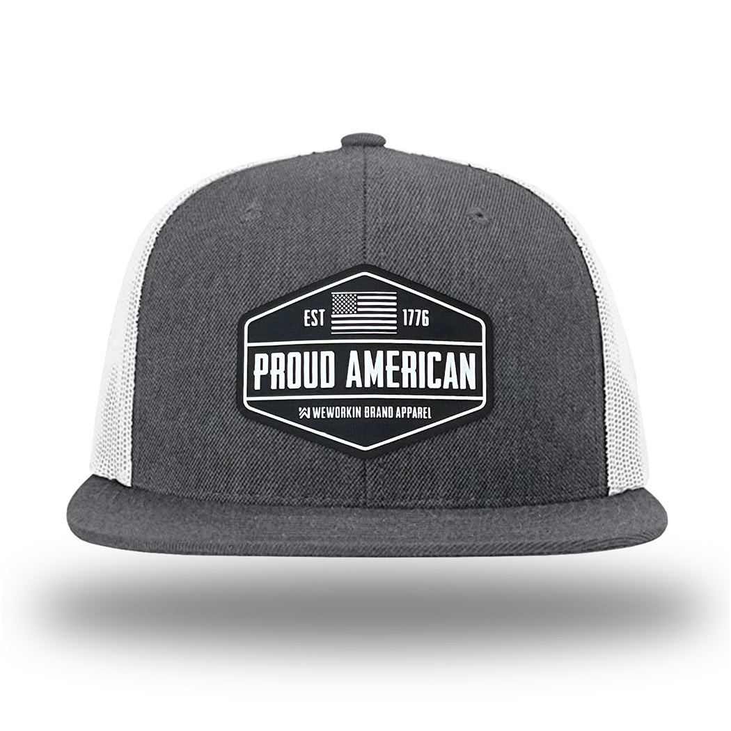 Heather Charcoal/White WeWorkin hat—Richardson 511 brand snapback, flatbill trucker hat style. WeWorkin black and white "PROUD AMERICAN" silicone patch is centered on the front panels.