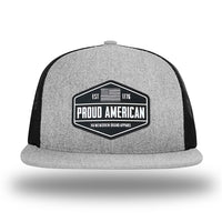 Heather Grey/Black WeWorkin hat—Richardson 511 brand snapback, flatbill trucker hat style. WeWorkin black and white "PROUD AMERICAN" silicone patch is centered on the front panels.