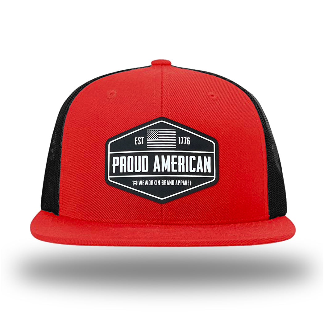Red/Black WeWorkin hat—Richardson 511 brand snapback, flatbill trucker hat style. WeWorkin black and white "PROUD AMERICAN" silicone patch is centered on the front panels.