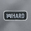 "WW HARD" text and rope design centered large on velcro-backed patch (both the hook and loop sides provided). [2] thread colors for the design (medium grey and white) on a black woven background, with white merrowed border. 3.5" wide Woven patch displayed on a grey canvas background.