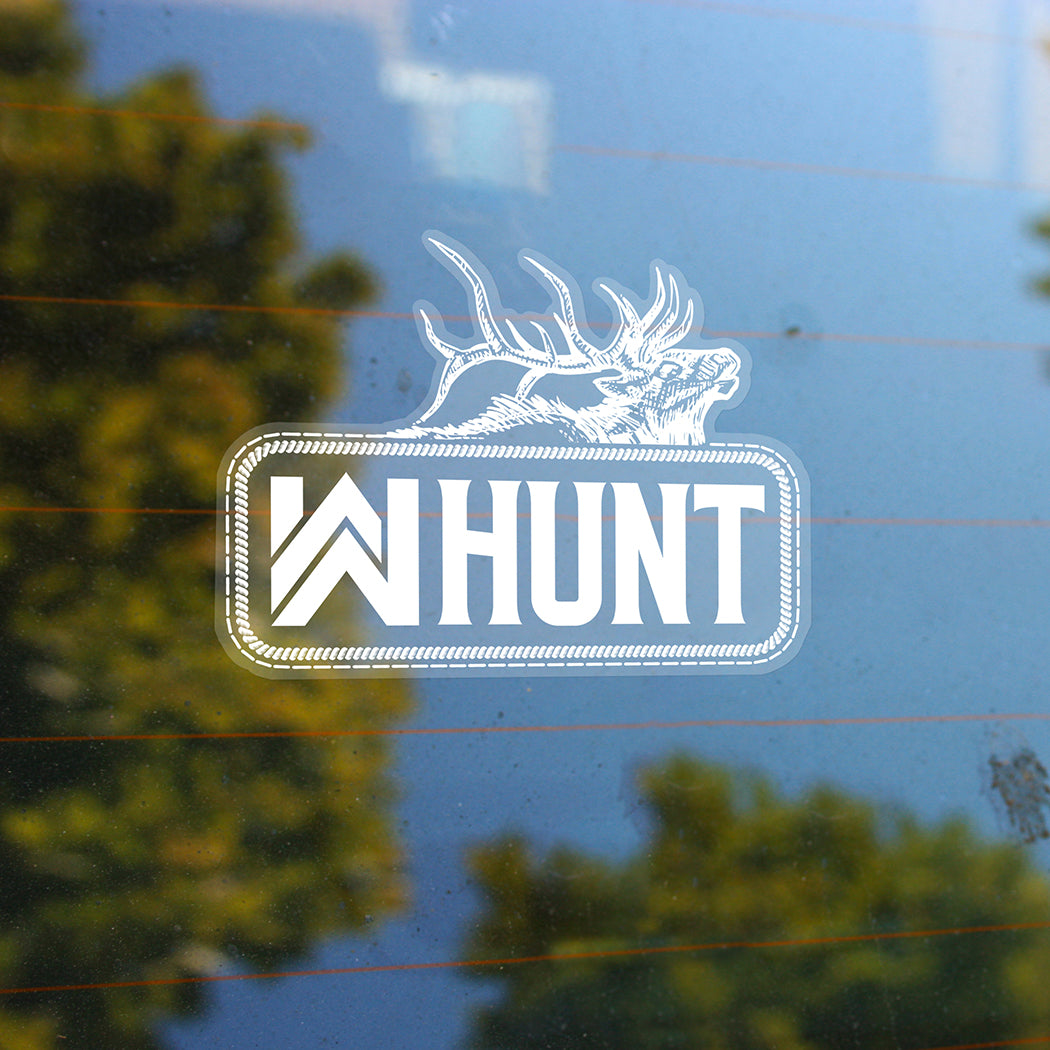 Small WW HUNT white print/clear sticker—custom die-cut clear-background sticker, on the rear window of a vehicle.