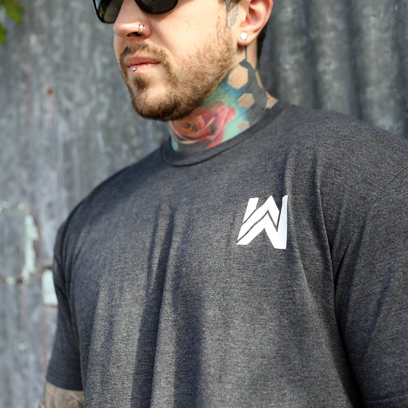 Man pictured from the front wearing the Heather Charcoal Grey WeWorkin tee with the WW icon small on the left chest area, printed in white ink. 