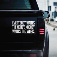 Large WEWORKIN BRAND "EVERYBODY WANT$ THE MONEY..." white Decal—Custom die-cut Direct Transfer decal/sticker on the tailgate of a black pickup truck.