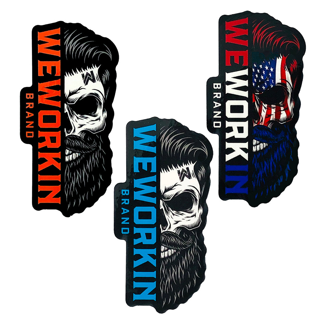 (3) WeWorkin Brand stickers on a white background. These WEWORKIN Brand Bearded Skull stickers  are die-cut in (3) different color combinations: blaze orange/white/black, teal/white/black, and red/white/blue. They are top quality vinyl stickers—outdoor weather resistant, scratch and sun-proof (UV Laminated White Polypropylene). Each sticker measures approximately 1.75"W x 3.5"